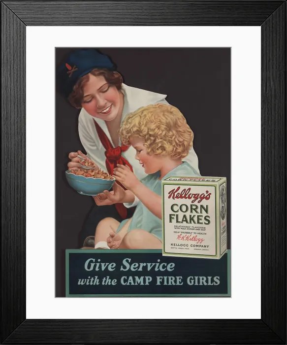 Framed Print : 1929 advertisement for Kellogg's Corn Flakes, showing a Camp Fire Girl feeding cereal to a small child Framed Print : 1929 advertisement for Kellogg's Corn Flakes, showing a Camp Fire Girl feeding cereal to a small child