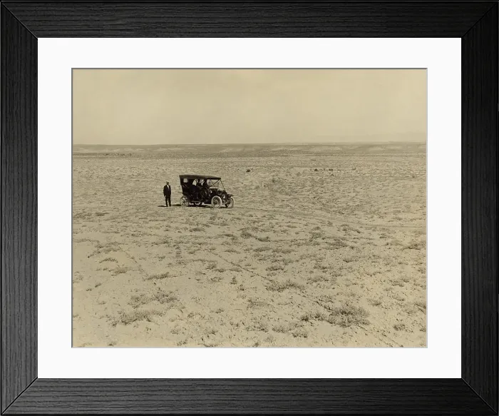 Framed Print : Early automobile parked in an expansive area of barren land in the Grand Valley, Mesa County, Colorado, c. 1912