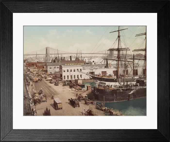 Framed Print : Wagons transport cargo to and from the ships and piers on Manhattan's South Street in 1901. In the background is the Brooklyn Bridge over the East River (BSLOC_2018_2_162) Framed Print : Wagons transport cargo to and from the ships and piers on Manhattan's South Street in 1901. In the background is the Brooklyn Bridge over the East River (BSLOC_2018_2_162)