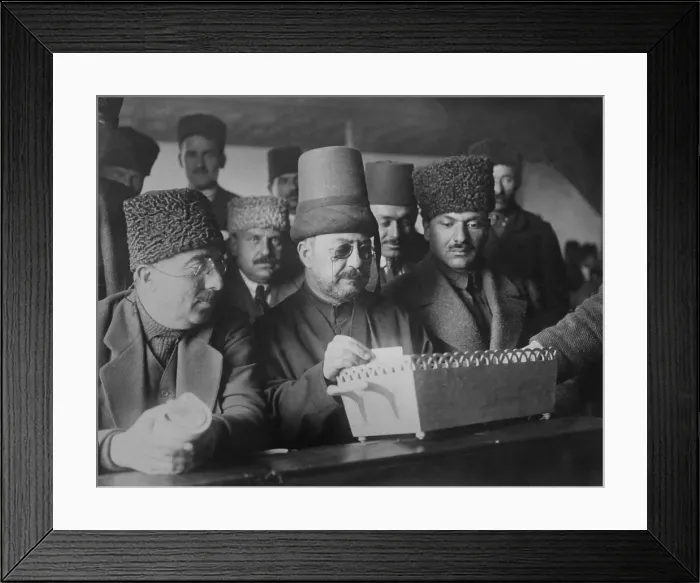 Framed Print : Delegates of the Turkish Grand National Assembly looking into ballot box. Ankara, Turkey, 1921 (BSLOC_2020_2_173)
