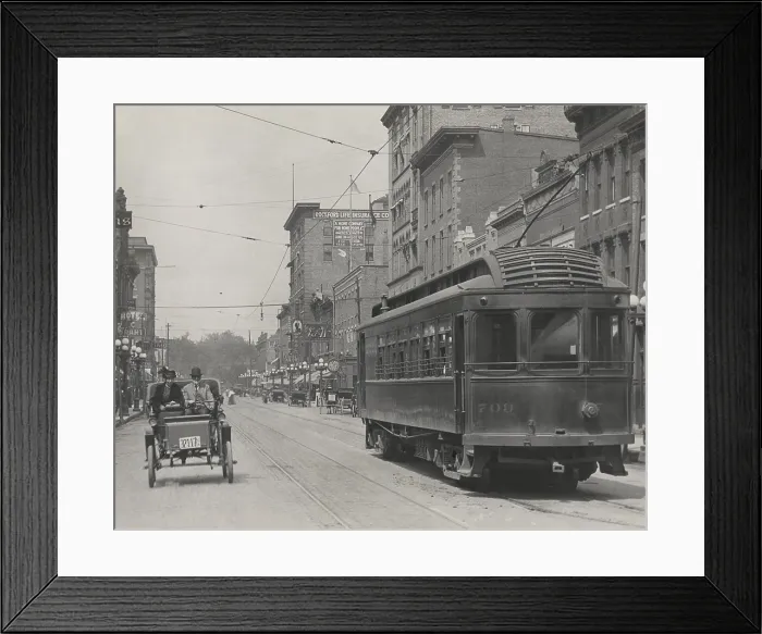 Framed Print : An automobile shares a street with a trolley car in the business district of Rockford, Illinois, c.1910 Framed Print : An automobile shares a street with a trolley car in the business district of Rockford, Illinois, c.1910