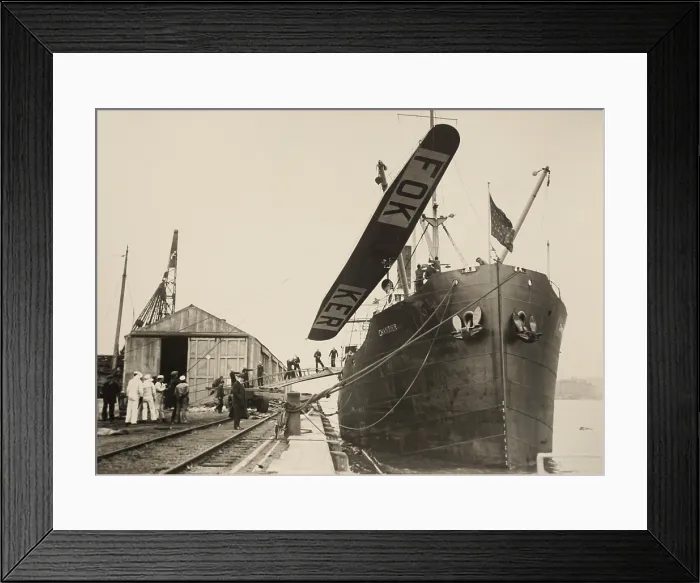 Framed Print : The wing of a Fokker Tri-motor monoplane hoisted above the SS Chantier, May-June 1926