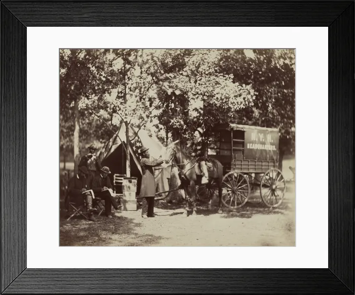 Framed Print : New York Herald Headquarters wagon and reporters in the field during the US Civil War. They are equipped with army tents and a converted ambulance for their horse drawn wagon