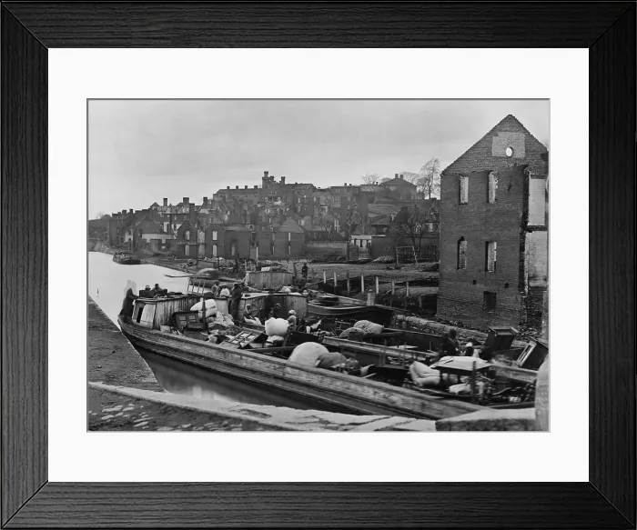 Framed Print : African American refugees sit in a boat with household belongings in a Richmond, Virginia canal