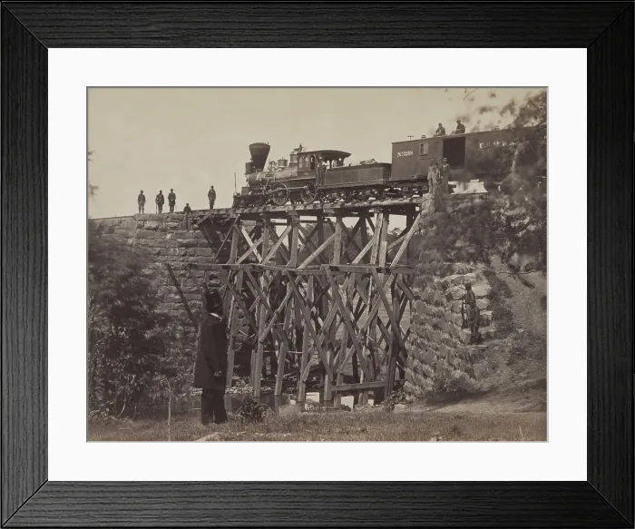 Framed Print : US Military Railroad locomotive and box cars on a high section of track Framed Print : US Military Railroad locomotive and box cars on a high section of track