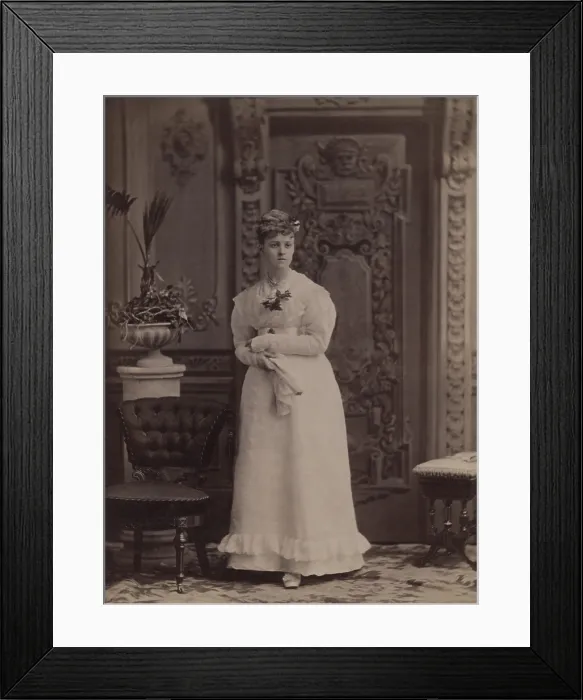 Framed Print : 16-year-old Edith Newbold Jones (later Edith Wharton) wears a formal dress, with her hair put up. She is photographed in a highly decorated gilded age interior in 1876 Framed Print : 16-year-old Edith Newbold Jones (later Edith Wharton) wears a formal dress, with her hair put up. She is photographed in a highly decorated gilded age interior in 1876