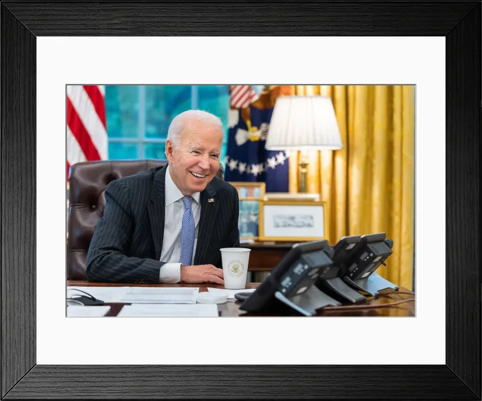Framed Print : President Joe Biden talks on the phone with House Speaker Nancy Pelosi, regarding the upcoming vote on the administration's economic agenda, Nov. 3, 2021
