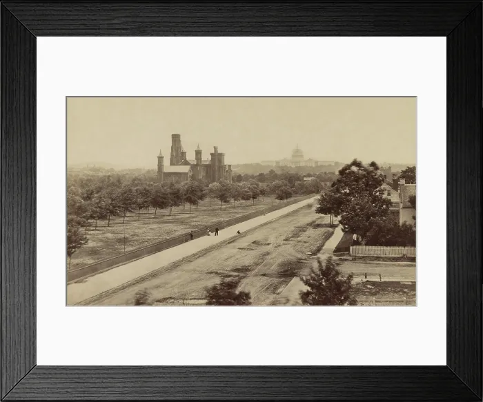 Framed Print : Elevated view of the Smithsonian Institution building in the near distance with the Capitol building in the background