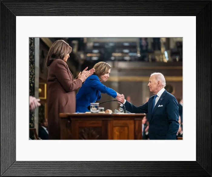 Framed Print : President Joe Biden shakes hands with House Speaker Nancy Pelosi after delivering his State of the Union address to Congress, March 1, 2022
