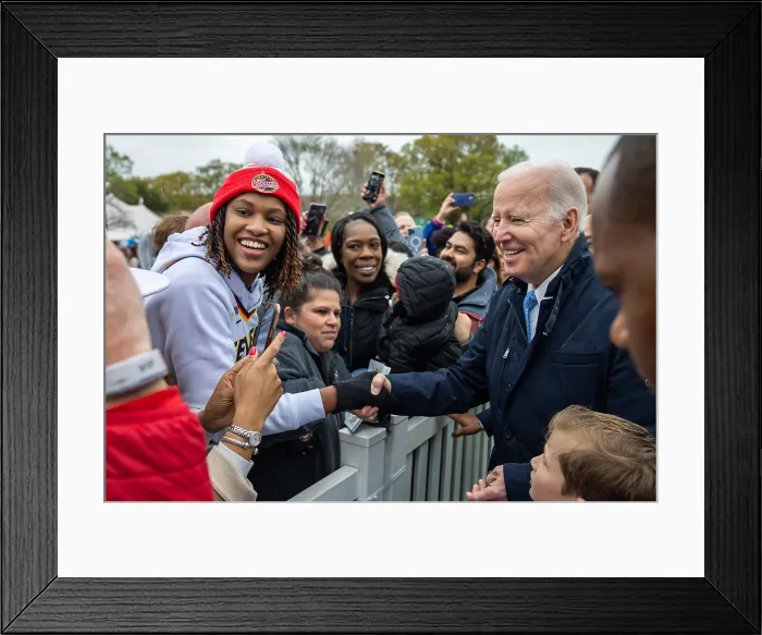 Framed Print : President Joe Biden shakes hands with a multiracial group of guests attending the White House Easter Egg Roll on the White House South Lawn, April 18, 2022. (BSLOC_2022_3_20) Framed Print : President Joe Biden shakes hands with a multiracial group of guests attending the White House Easter Egg Roll on the White House South Lawn, April 18, 2022. (BSLOC_2022_3_20)