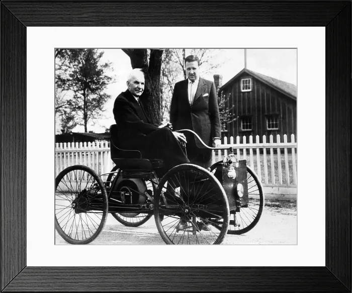 Framed Print : Henry Ford sits in his first Ford car built in 1896, as his grandson, Henry Ford II stands nearby. ca. 1946. Courtesy: CSU Archives / Everett Collection