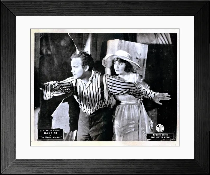 Framed Print : THE MASTER MYSTERY, from left, Harry Houdini, Marguerite Marsh, episode three, The Water Peril, 1919