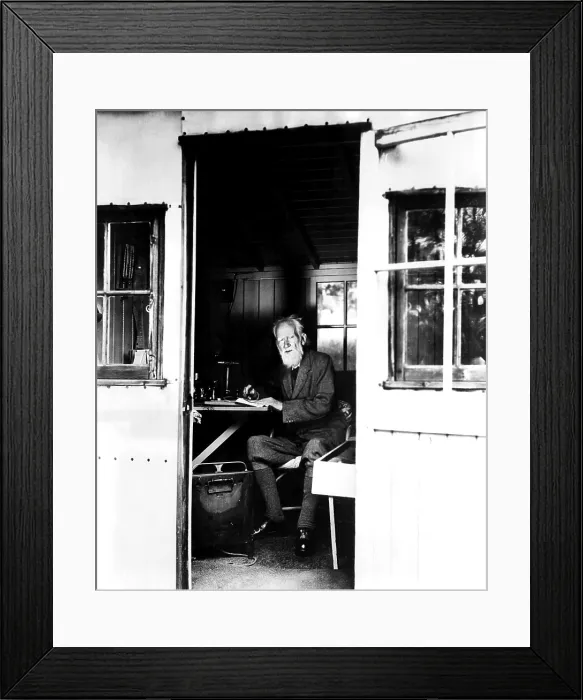 Framed Print : Playwright George Bernard Shaw making notes on the movie version of his play CAESAR AND CLEOPATRA at his country home outside London. October 26, 1945