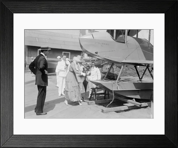 Framed Print : Vincent Astor (front left), Helen Dinsmore Huntington Astor (front right), christening an airplane, circa 1910s Framed Print : Vincent Astor (front left), Helen Dinsmore Huntington Astor (front right), christening an airplane, circa 1910s