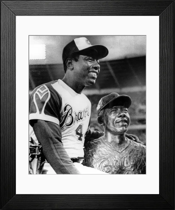 Framed Print : Hank Aaron poses with bust of himself on eve of breaking Babe Ruth's career home run record of 714. Atlanta, GA, 04-08-1974.. Courtesy: CSU Archives  /  Everett Collection