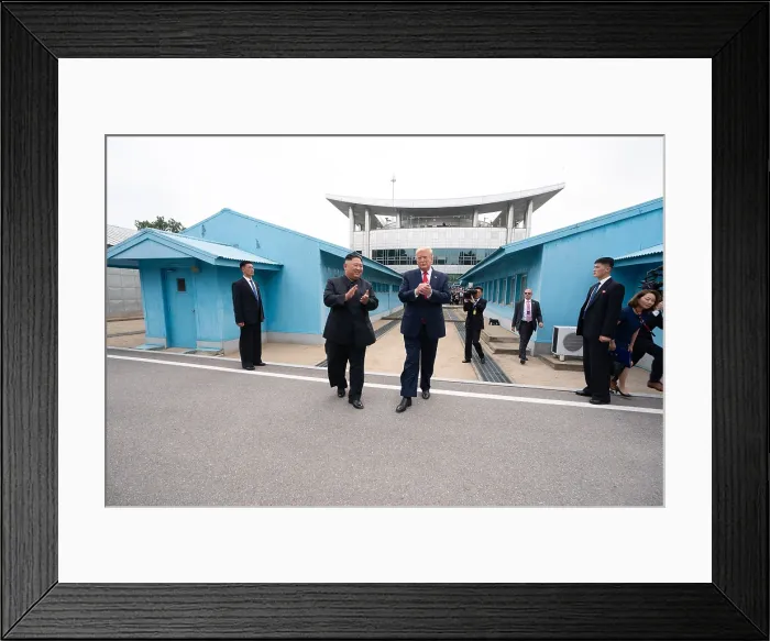 Framed Print : President Donald Trump and Kim Jong Un applaud as they take their first steps together in North Korea, June 30, 2019