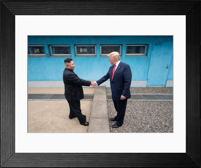 Framed Print : President Donald Trump shakes hands with Chairman of the Workers Party of Korea, Kim Jong Un, across the boundary of North Korea and South Korea, in the Demilitarized Zone Framed Print : President Donald Trump shakes hands with Chairman of the Workers Party of Korea, Kim Jong Un, across the boundary of North Korea and South Korea, in the Demilitarized Zone