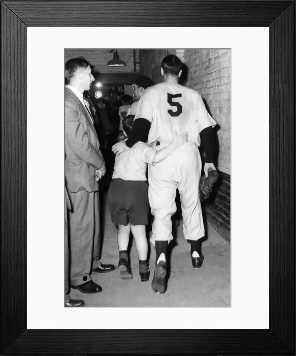 Framed Print : Joe DiMaggio and his son walk to the locker room after the New York Yankees victory in the World Series, 1949. Courtesy: CSU Archives / Everett Collection