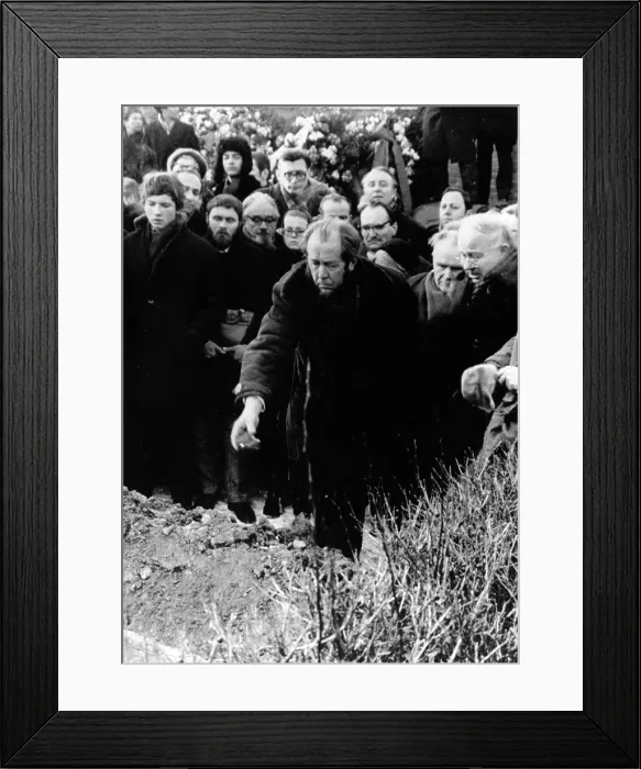 Framed Print : Author Alexander Solzhenitsyn tosses earth on coffin of Alexander Tvardovsky at funeral, December 21, 1971. Courtesy: CSU Archives  /  Everett Collection