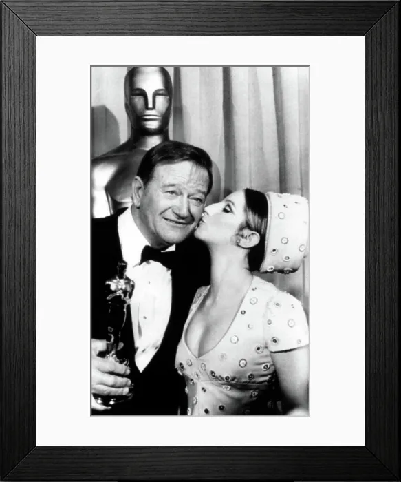 Framed Print : John Wayne congratulated by Barbra Streisand for winning Academy Award for TRUE GRIT, 4 / 7 / 70. Courtesy: CSU Archives  /  Everett Collection