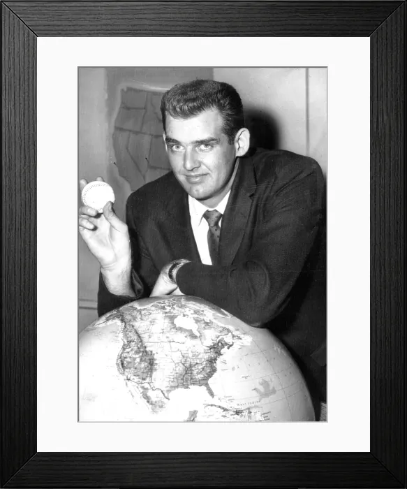 Framed Print : NY Yankee Pitcher Don Larsen shows off baseball he used to pitch perfect game against Brooklyn Dodgers in Game 5 of 1956 World Series on 10-08-56. Photo dated 10-09-56