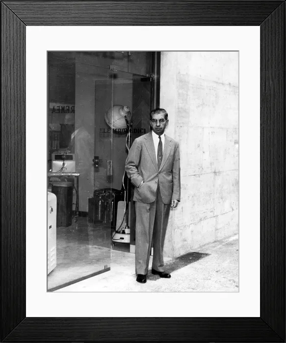 Framed Print : Charles Lucky Luciano standing in front of his Electrical Medical Appliances Shop in Naples, 1955. Courtesy: CSU Archives  /  Everett Collection