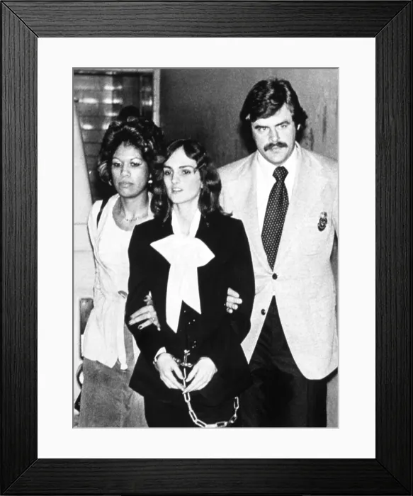 Framed Print : Patricia Hearst being lead from Federal Building in San Francisco, CA, by U.S. Marshals during her trial, 02 / 06 / 76.. Courtesy: CSU Archives  /  Everett Collection