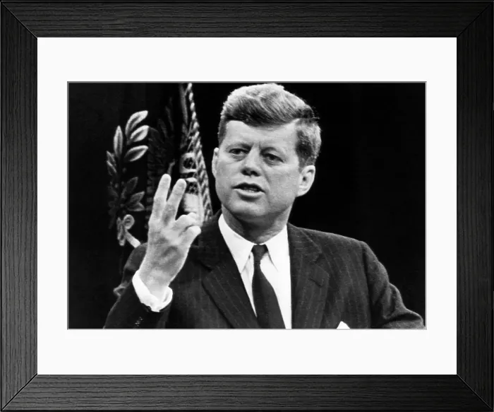 Framed Print : John F. Kennedy, stating that the U.S. is running second in the space exploration race. No amount of money could enable the U.S. to beat Russia to the Moon with the Saturn Rocket