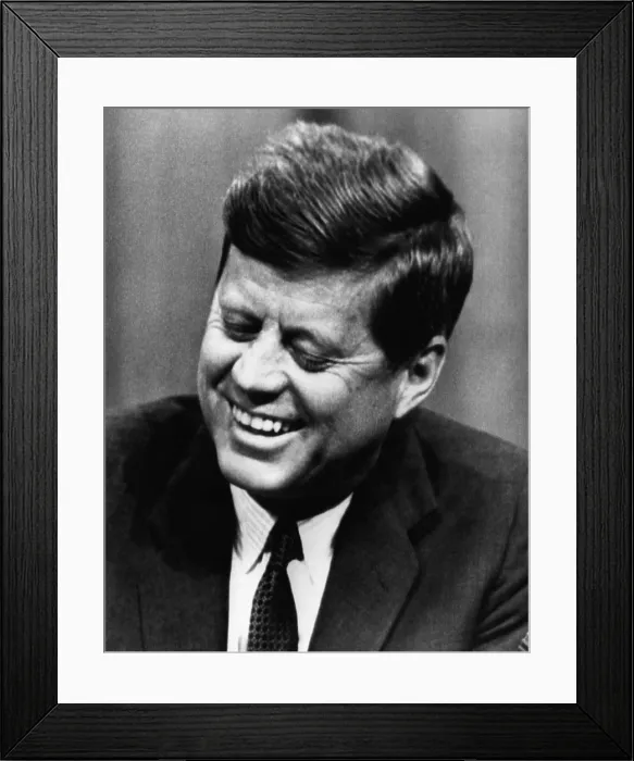 Framed Print : John F. Kennedy, laughs after stumbling over the pronunciation of the word proliferation at a press conference, April 18, 1962. Courtesy: CSU Archives / Everett Collection