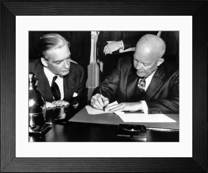 Framed Print : British Prime Minister Anthony Eden watches as President Dwight D. Eisenhower signs a joint statement on the 3 day talks between the two. February 1, 1956 Framed Print : British Prime Minister Anthony Eden watches as President Dwight D. Eisenhower signs a joint statement on the 3 day talks between the two. February 1, 1956