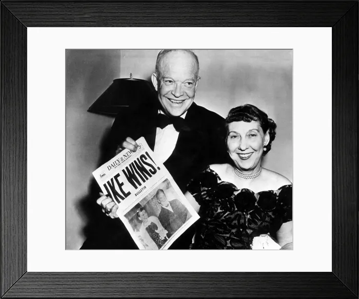 Framed Print : President Dwight D. Eisenhower and his wife, Mamie Eisenhower hold up a copy of the New York Daily News headlining Eisenhower's presidential victory. November 5, 1952 Framed Print : President Dwight D. Eisenhower and his wife, Mamie Eisenhower hold up a copy of the New York Daily News headlining Eisenhower's presidential victory. November 5, 1952