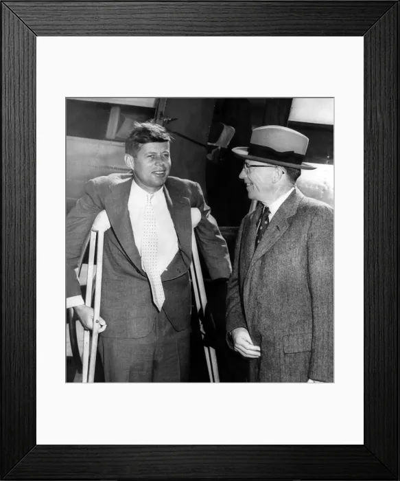 Framed Print : Senator John F. Kennedy, on crutches from a wartime back injury, Massachusetts Lieutenant Governor Robert F. Murphy, at Logan Airport in Boston, Massachusetts, c. 1959 Framed Print : Senator John F. Kennedy, on crutches from a wartime back injury, Massachusetts Lieutenant Governor Robert F. Murphy, at Logan Airport in Boston, Massachusetts, c. 1959