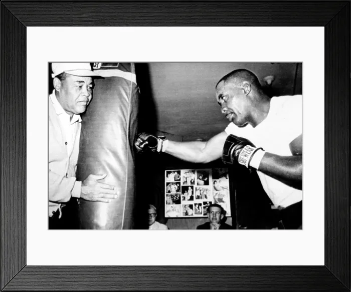 Framed Print : Sonny Liston working out on the heavy bag while Joe Louis holds it, 4 / 13 / 65 CSU Archives / Everett Collection