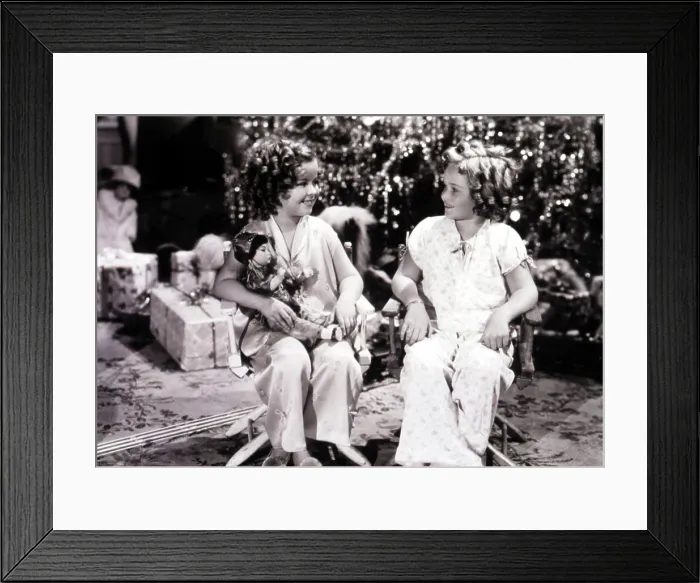 Framed Print : Shirley Temple with doll on the set with her stand-in Mary Lou Isheb, 1937. Courtesy: CSU Archives  /  Everett Collection