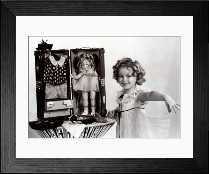 Framed Print : Shirley Temple with a Shirley Temple doll kit, 1935. Courtesy: CSU Archives / Everett Collection Framed Print : Shirley Temple with a Shirley Temple doll kit, 1935. Courtesy: CSU Archives / Everett Collection
