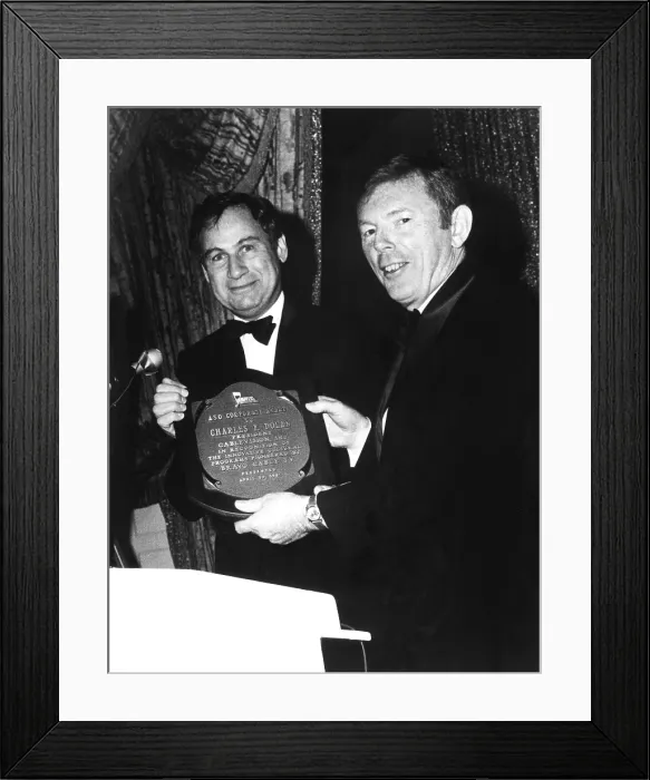 Framed Print : Charles F. Dolan (right) accept award for Bravo cable company's innovative accomplishments from Joel Berson of the American Symphony Orchesra, 1981 Framed Print : Charles F. Dolan (right) accept award for Bravo cable company's innovative accomplishments from Joel Berson of the American Symphony Orchesra, 1981
