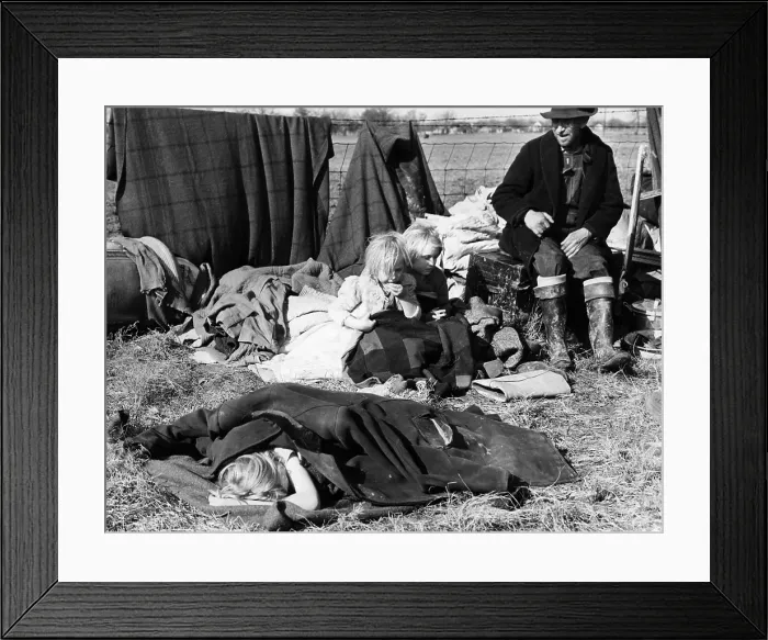 Framed Print : A Misouri sharecropper with his three little children sit with their posessions on the edge of a state highway after being evicted from their home. ca. 1939 Framed Print : A Misouri sharecropper with his three little children sit with their posessions on the edge of a state highway after being evicted from their home. ca. 1939