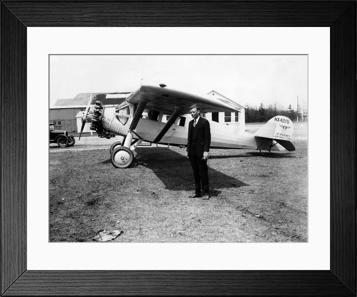 Framed Print : America pilot Charles Lindbergh, with his new monoplane in the background at Curtis Field, Long Island, New York, 1928.. Courtesy: CSU Archives  /  Everett Collection