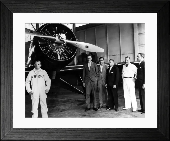 Framed Print : American pilot Charles Lindbergh, prepares for a flight to Greenland. L-R: F. Vernon Ash, Engineer of Wright Aeronautical Corp. Charles Lindbergh, P.B