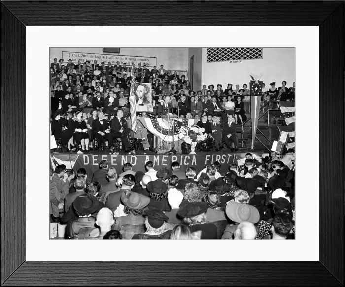 Framed Print : American pilot Charles Lindbergh (center, behind flag), speaks before a crowd of 3, 000 at a Fort Wayne Indiana Rally in Gospel Temple. October 4, 1941