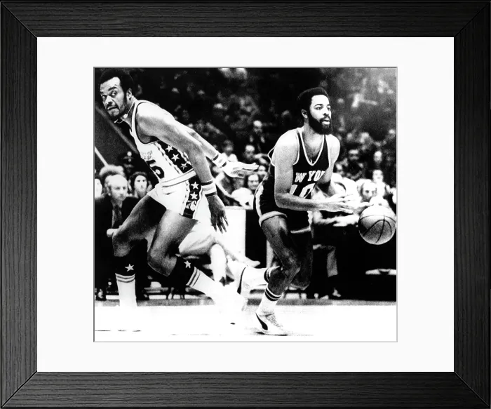 Framed Print : Philadelphia Sixers Bob Rule (L), & NY Knicks Walt Frazier (R), with the basketball, in their game in Phila, PA, January 7, 1972 Framed Print : Philadelphia Sixers Bob Rule (L), & NY Knicks Walt Frazier (R), with the basketball, in their game in Phila, PA, January 7, 1972