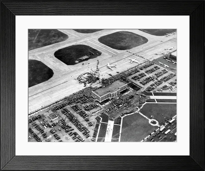 Framed Print : Howard Hughes lands at Floyd Bennett Airport in his silver monoplane after completing his record-breaking 91 hour flight around the world. New York, July 14, 1938