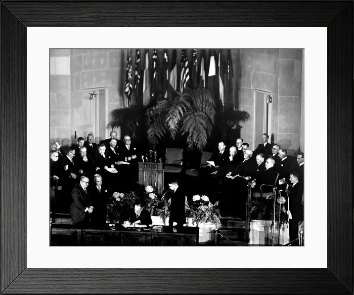 Framed Print : NATO, President Truman and V.P. Barkley, look on as Secretary of the State Dean Acheson signs the North Atlantic Treaty signing ceremony in Washington D.C. John W