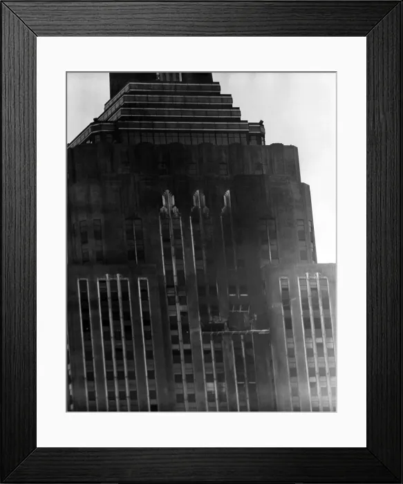 Framed Print : A close up view of damage to the south side wall of the Empire State Building the day after a B-25 Bomber accidently crashed into the 78th story. New York, New York