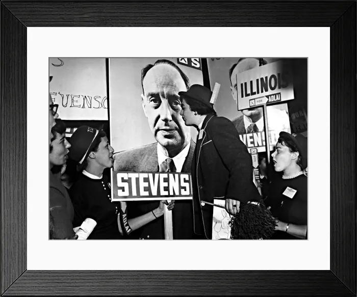 Framed Print : ADLAI STEVENSON, presidential candidate, is pictured on this campaign sign, which is being kissed by Betty Lonn and other Northwestern University students