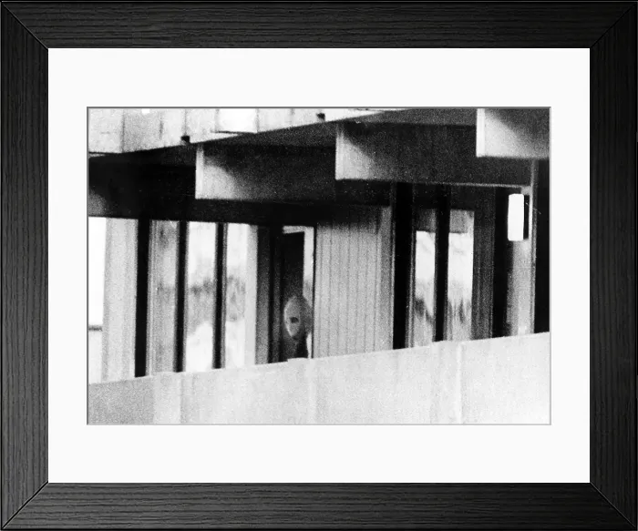 Framed Print : 1972 Olympics, Terrorist from Black September peers out of apartment in Olympic Village, Munich, Germany. 09-05-1972.. Courtesy: CSU Archives  /  Everett Collection