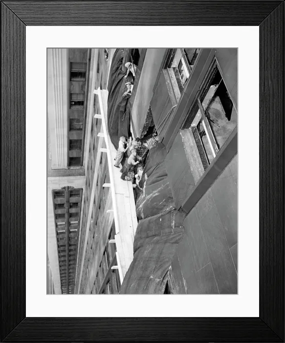 Framed Print : Repairs underway on the Empire State Building after a B-25 Bomber accidentally crashed into the 78th story. New York, New York. July 29, 1945