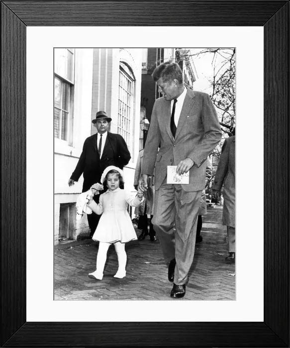 Framed Print : President-elect John F. Kennedy, and Caroline Kennedy, walk to church from their home on her third birthday. John F. Kennedy holds a children's prayer book, November 27, 1960