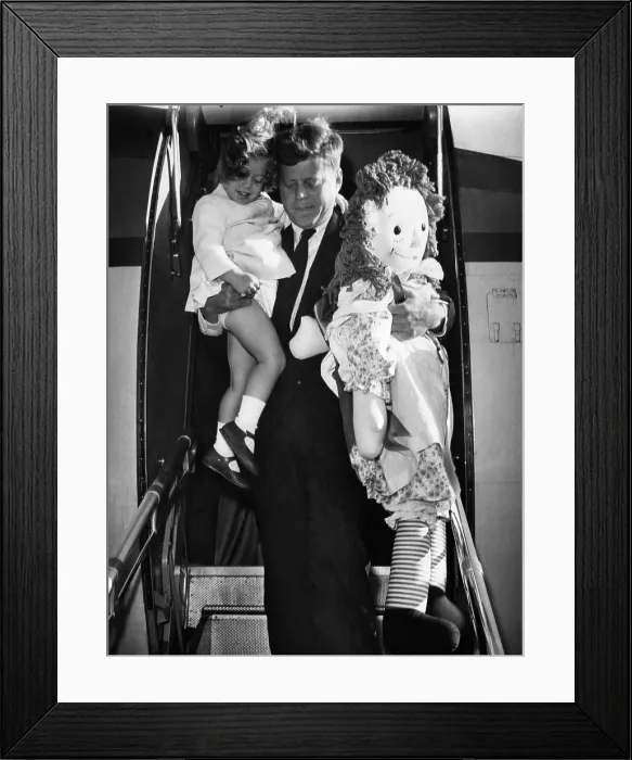 Framed Print : Senator John F. Kennedy (right), and Caroline Kennedy (left), exiting a plane