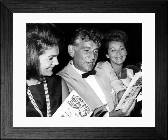 Framed Print : Jacqueline Kennedy, Leonard Bernstein and Felicia Montealegre look at their programs during a performance of Leonard Bernstein's Theatre Songs, 1965